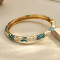 18K Gold Coated Enamel Bangle – Sky Blue & White Curves