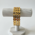 Diamond Link Gold Bangles on Stand