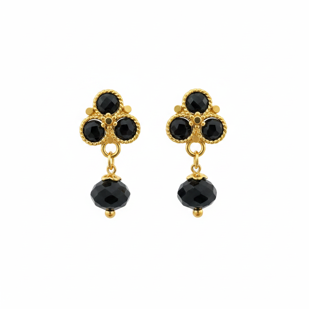 Gold and black onyx earrings on white background - no reflection bright gold