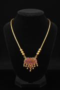 Ruby Stone Fan Pendant Necklace on black background