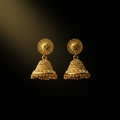 Gold jhumka earrings with floral stud and bell dome on black background