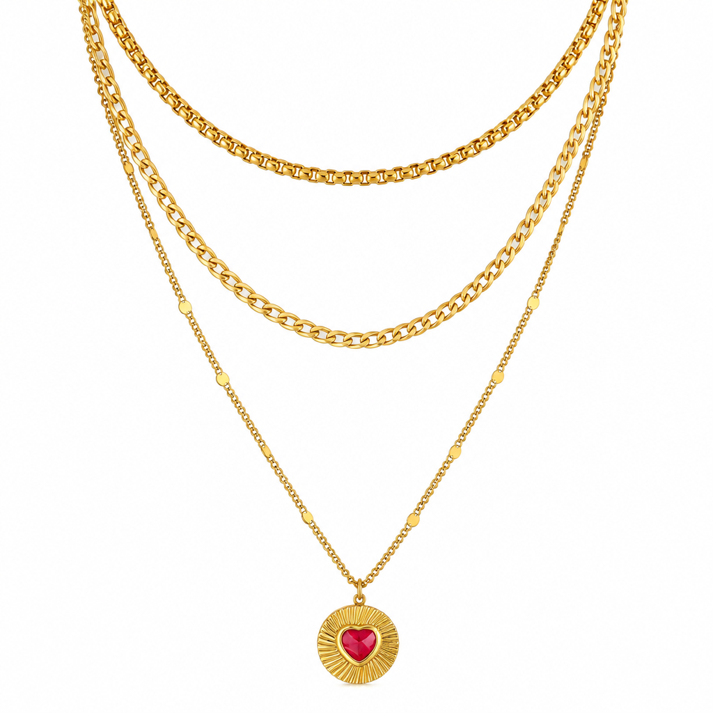 Gold plated jewellery on a clean white background