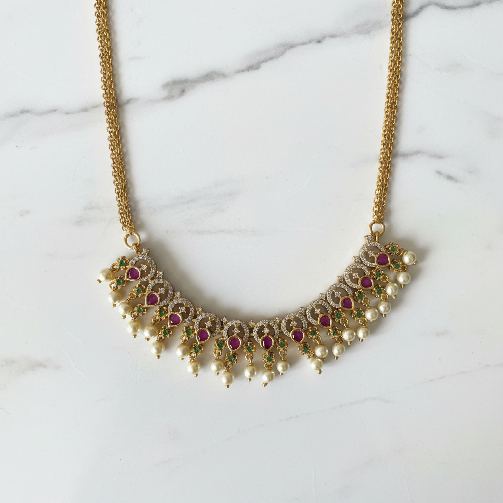 Ruby Emerald Pearl Gold Necklace Flat Lay